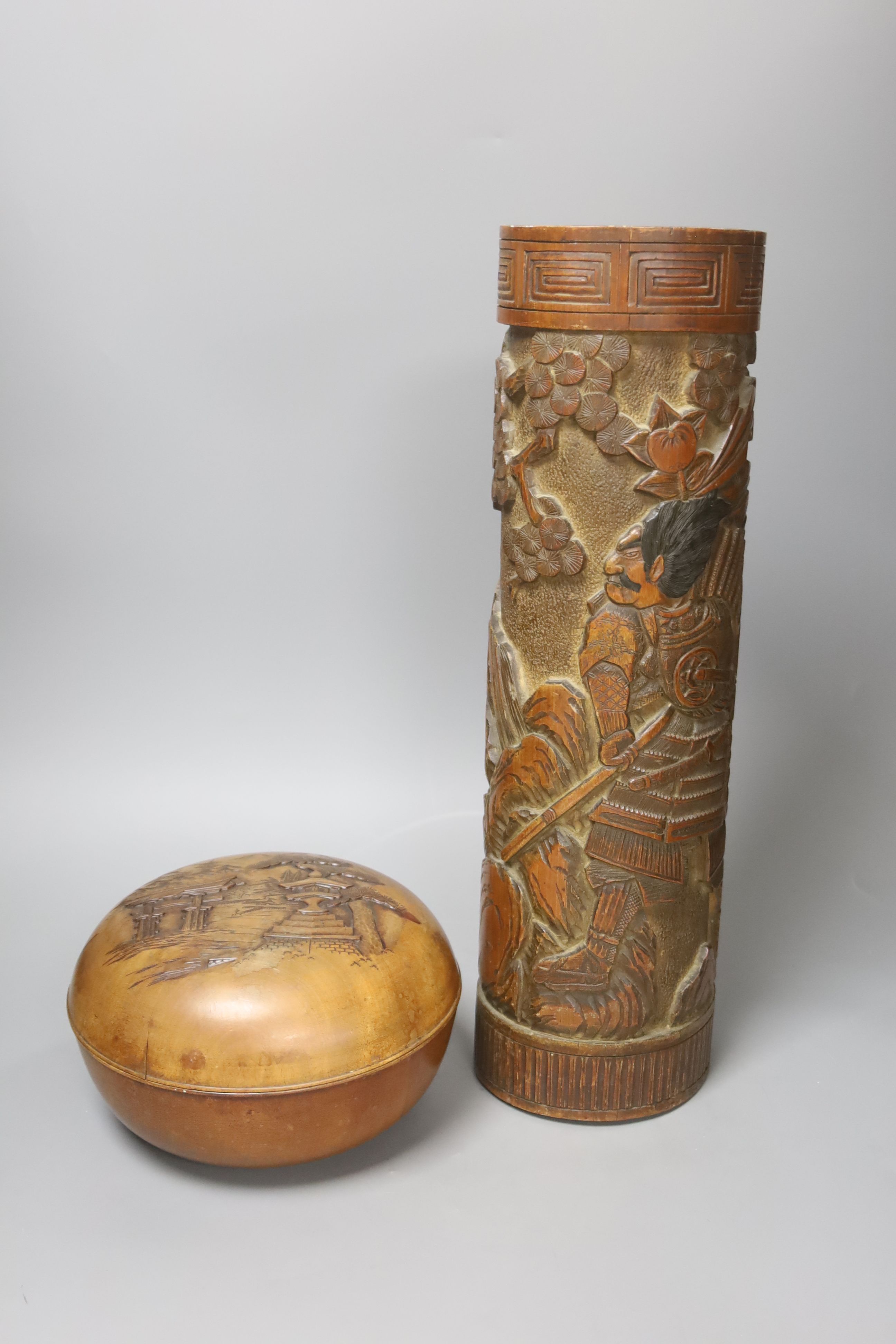 A Japanese carved bamboo brushpot, height 45cm, and Japanese carved wood circular lidded box